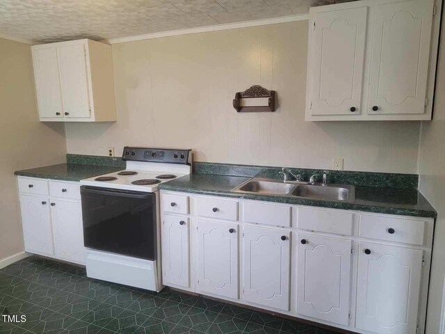 3354 Altamahaw Church St, Elon, NC 27244 - kitchen featuring electric range, a sink, dark countertops, white cabinets, and ornamental molding