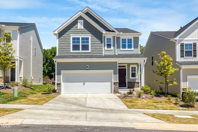 1007 Sora Way, Durham, NC 27703 - craftsman house featuring an attached garage, stone siding, and driveway