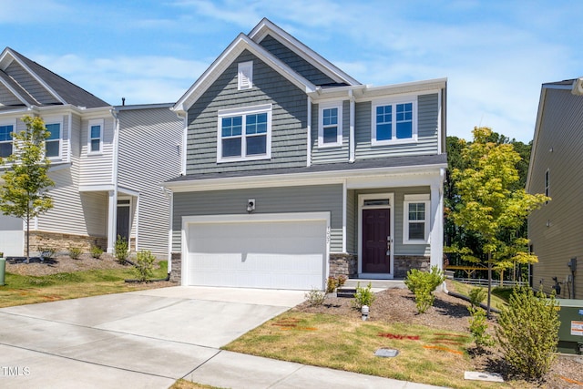 1007 Sora Way, Durham, NC 27703 - craftsman inspired home featuring stone siding, an attached garage, and driveway