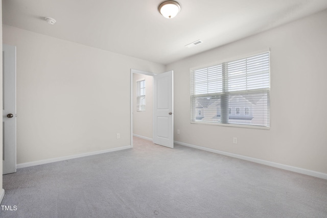 1007 Sora Way, Durham, NC 27703 - spare room featuring carpet floors, a smoke detector, and baseboards