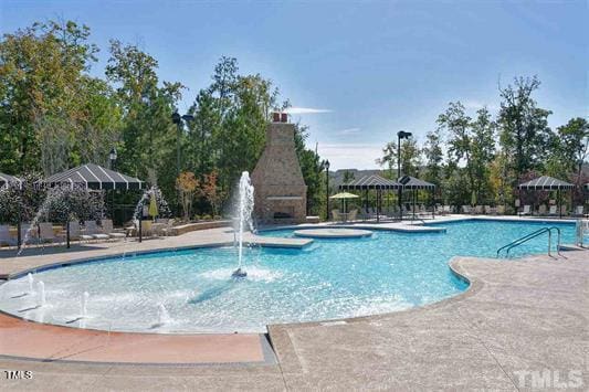 211 Ibis Ln, Durham, NC 27703 - community pool with a patio area