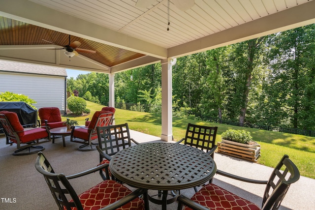 211 Ibis Ln, Durham, NC 27703 - view of patio featuring ceiling fan, outdoor dining area, and view of wooded area