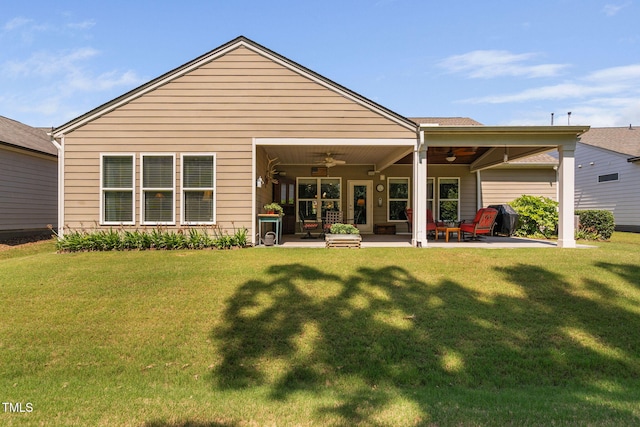 211 Ibis Ln, Durham, NC 27703 - rear view of house with ceiling fan, a patio, and a yard