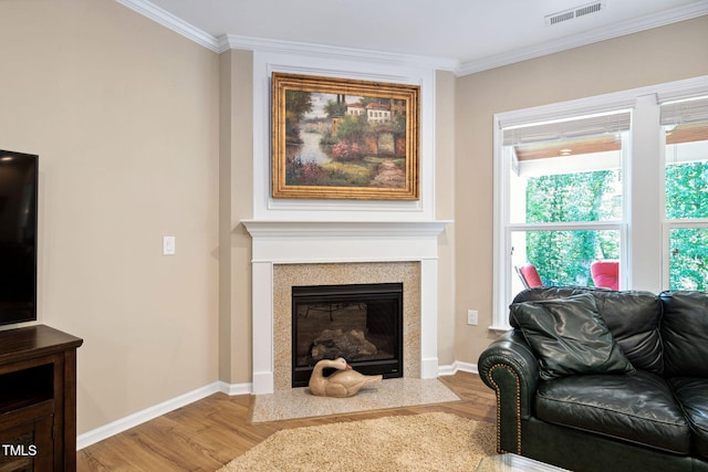 211 Ibis Ln, Durham, NC 27703 - living area with wood finished floors, ornamental molding, plenty of natural light, and a fireplace with flush hearth