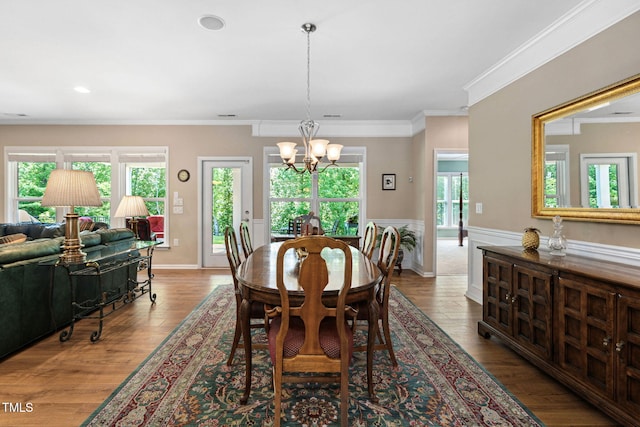 211 Ibis Ln, Durham, NC 27703 - dining space featuring a chandelier, wood finished floors, ornamental molding, recessed lighting, and wainscoting