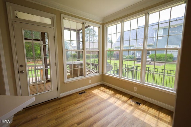 10 London Way, Spring Lake, NC 28390 - unfurnished sunroom with baseboards, ornamental molding, and wood finished floors
