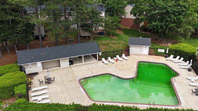 7719 Kingsberry Ct, Raleigh, NC 27615 - community pool featuring fence, an outdoor structure, and a patio