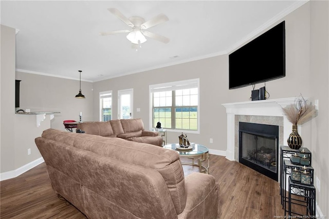 341 Woodington Rd, Hope Mills, NC 28348 - living area with wood finished floors, baseboards, ceiling fan, and crown molding