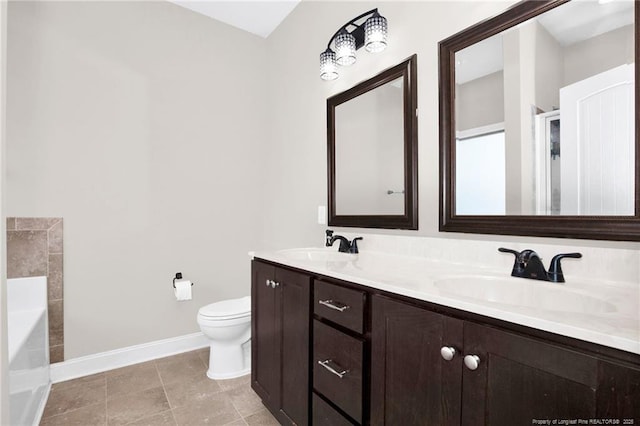 341 Woodington Rd, Hope Mills, NC 28348 - full bath featuring baseboards, toilet, a garden tub, double vanity, and tile patterned flooring