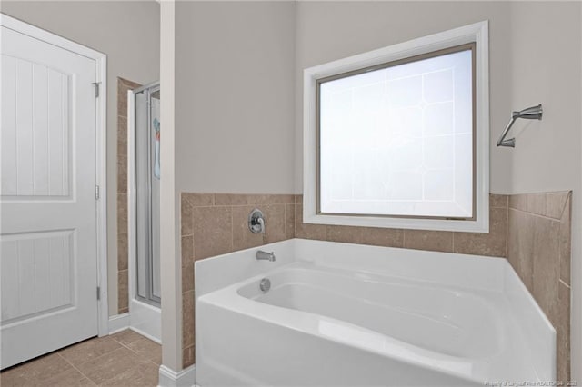 341 Woodington Rd, Hope Mills, NC 28348 - full bathroom featuring a garden tub, a shower stall, and tile patterned flooring