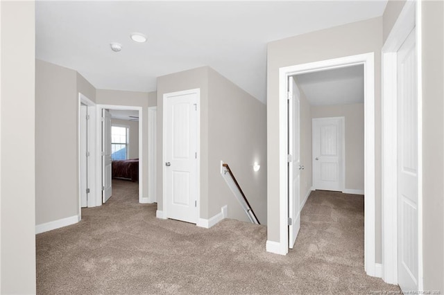 341 Woodington Rd, Hope Mills, NC 28348 - hallway with an upstairs landing, carpet flooring, and baseboards