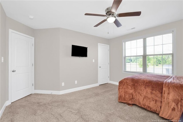 341 Woodington Rd, Hope Mills, NC 28348 - bedroom with light colored carpet, baseboards, and a ceiling fan