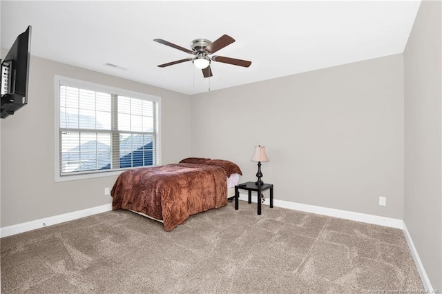 341 Woodington Rd, Hope Mills, NC 28348 - carpeted bedroom featuring baseboards and a ceiling fan