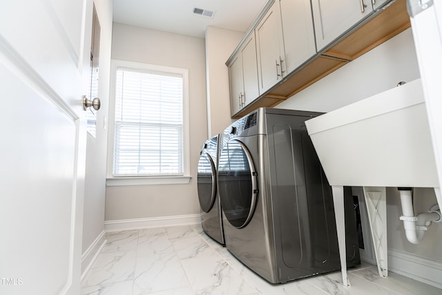 2918 Heirloom Way, Apex, NC 27502 - washroom with light marble finish flooring, cabinet space, baseboards, and washer and dryer