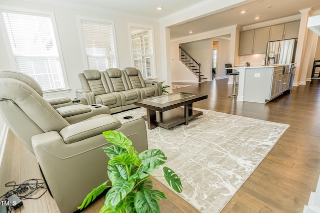 2918 Heirloom Way, Apex, NC 27502 - living area featuring stairs, ornamental molding, dark wood-style flooring, recessed lighting, and baseboards