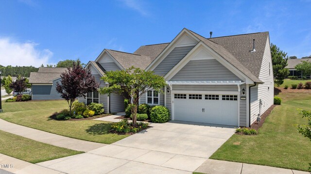 1112 Monterey Bay Dr, Wake Forest, NC 27587 - view of front of home featuring a garage, a front yard, concrete driveway, and roof with shingles