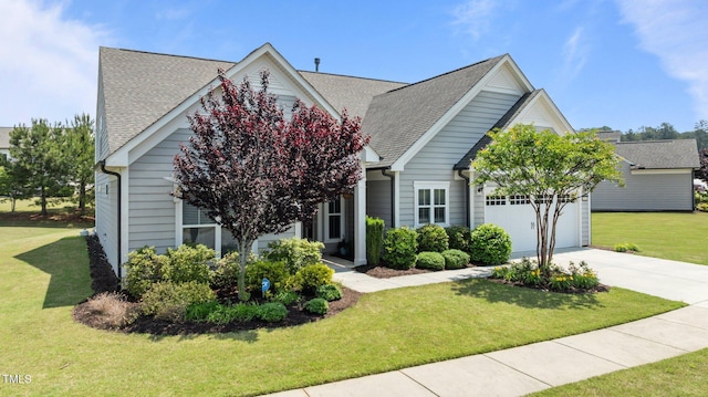 1112 Monterey Bay Dr, Wake Forest, NC 27587 - view of front of house featuring a garage, driveway, a shingled roof, and a front yard