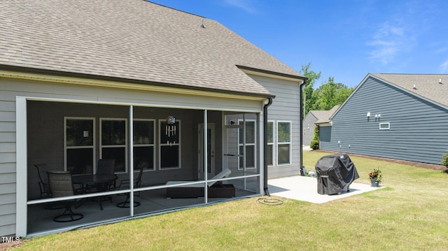 1112 Monterey Bay Dr, Wake Forest, NC 27587 - rear view of house featuring a patio, a sunroom, a yard, and roof with shingles