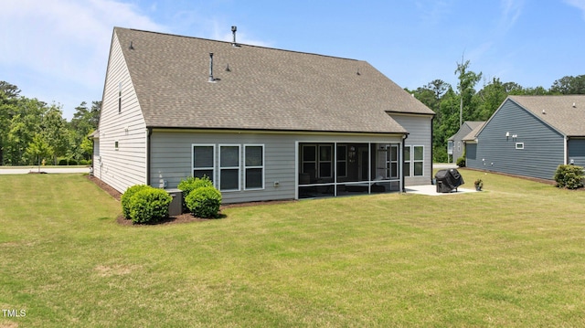 1112 Monterey Bay Dr, Wake Forest, NC 27587 - rear view of property featuring a sunroom, a lawn, and a shingled roof
