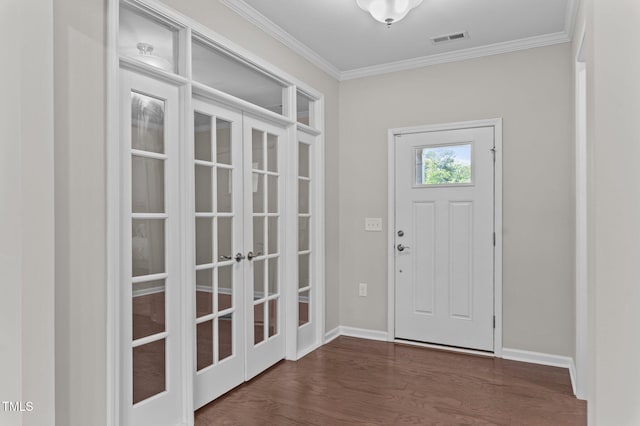 1112 Monterey Bay Dr, Wake Forest, NC 27587 - entryway featuring french doors, ornamental molding, dark wood finished floors, and baseboards
