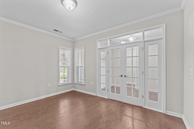 1112 Monterey Bay Dr, Wake Forest, NC 27587 - spare room featuring dark wood-style flooring, french doors, ornamental molding, and baseboards