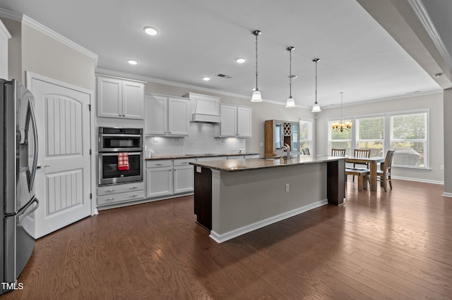 1112 Monterey Bay Dr, Wake Forest, NC 27587 - kitchen featuring appliances with stainless steel finishes, crown molding, a chandelier, recessed lighting, and premium range hood