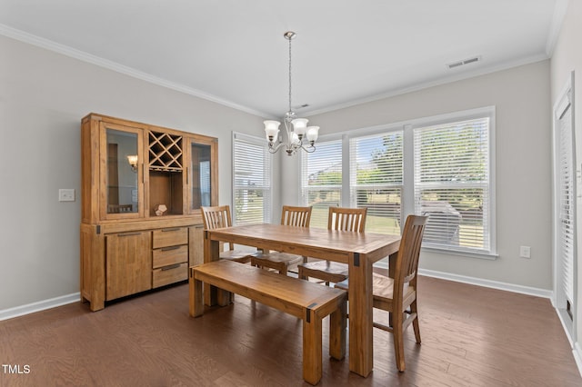 1112 Monterey Bay Dr, Wake Forest, NC 27587 - dining space featuring a chandelier, dark wood-style floors, baseboards, and ornamental molding