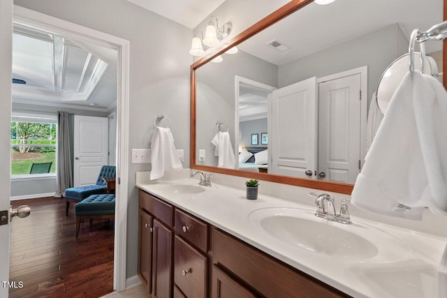 3002 Bartlett Cir, Hillsborough, NC 27278 - bathroom featuring double vanity, hardwood / wood-style floors, ensuite bath, and ornamental molding