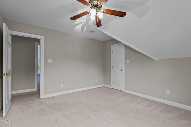 bonus room with carpet flooring, ceiling fan, baseboards, and vaulted ceiling
