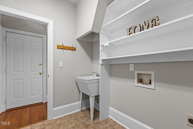 washroom featuring washer hookup, electric dryer hookup, and baseboards