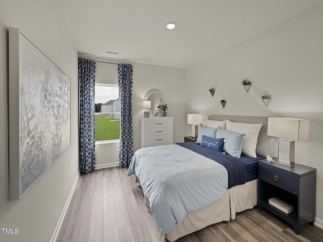 2242 Cherry Creek Rd, Haw River, NC 27258 - bedroom with wood finished floors, baseboards, and recessed lighting