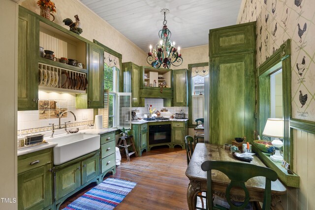 517 N E St, Raleigh, NC 27604 - kitchen with green cabinets, open shelves, oven, a sink, and light countertops