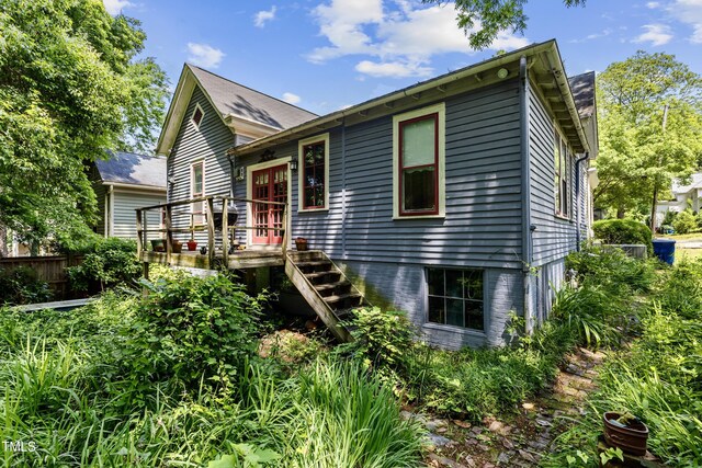 517 N E St, Raleigh, NC 27604 - view of front facade featuring a wooden deck and stairs