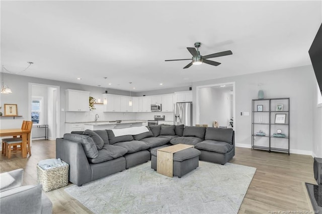 607 Rempstone Ln, Fayetteville, NC 28311 - living room with ceiling fan, light wood-style floors, recessed lighting, and baseboards
