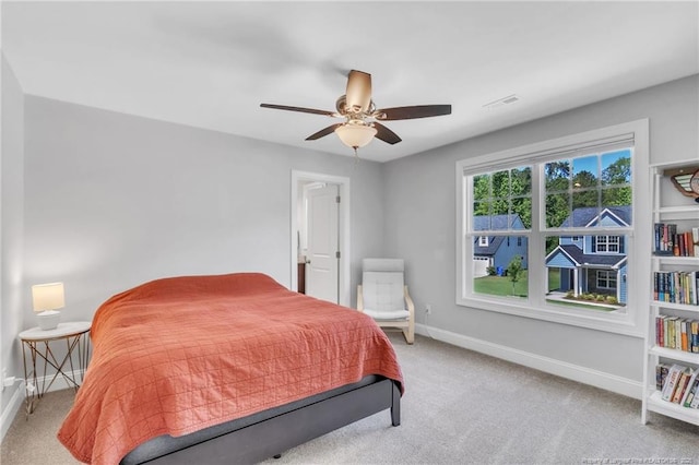 607 Rempstone Ln, Fayetteville, NC 28311 - bedroom with light carpet, baseboards, and a ceiling fan