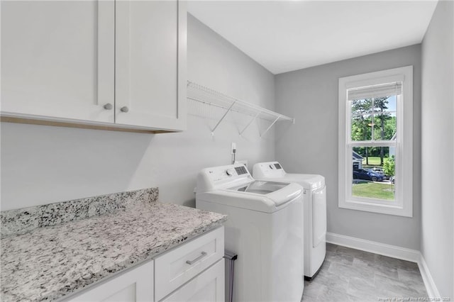 607 Rempstone Ln, Fayetteville, NC 28311 - washroom with washing machine and dryer, cabinet space, and baseboards