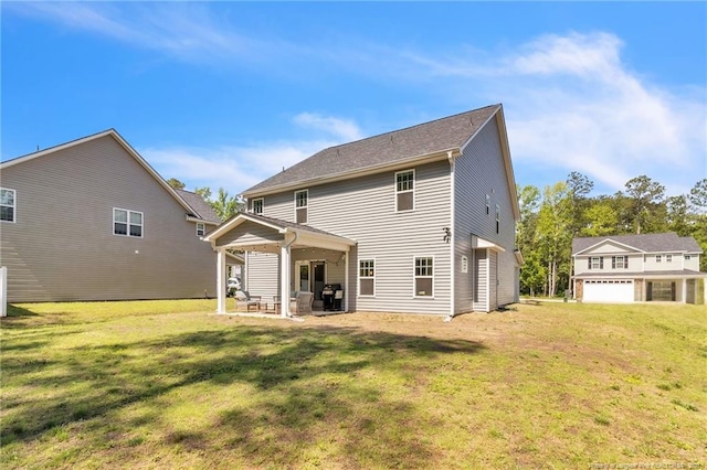 607 Rempstone Ln, Fayetteville, NC 28311 - back of house featuring a lawn and a patio