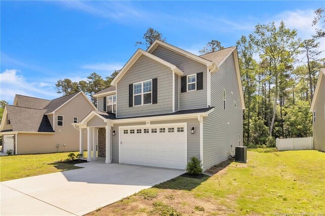 607 Rempstone Ln, Fayetteville, NC 28311 - view of front of house featuring a garage, concrete driveway, and a front lawn