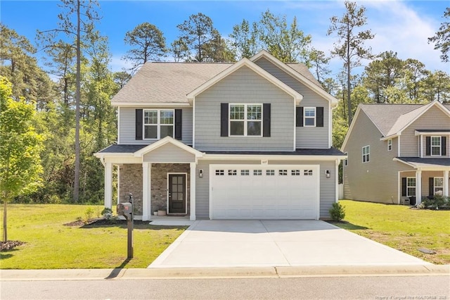 607 Rempstone Ln, Fayetteville, NC 28311 - view of front of house with driveway, a garage, and a front lawn