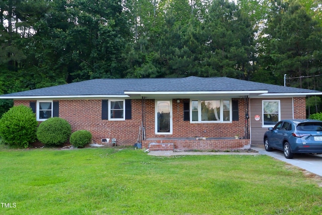 6591 Goldsboro Rd, Wade, NC 28395 - view of front facade with a front yard, brick siding, and a shingled roof