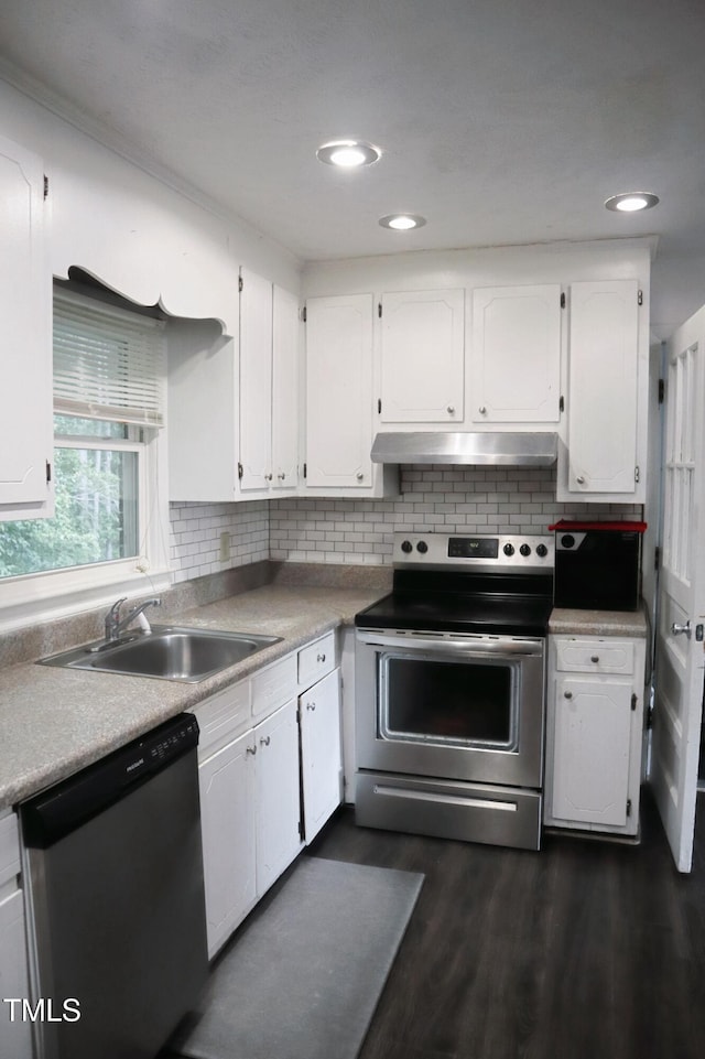 6591 Goldsboro Rd, Wade, NC 28395 - kitchen with appliances with stainless steel finishes, a sink, white cabinetry, and recessed lighting