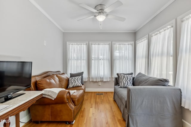 1304 N Duke St, Durham, NC 27701 - living room with ceiling fan, light wood-style floors, ornamental molding, and baseboards