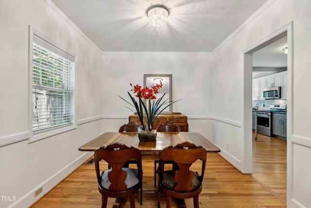 1304 N Duke St, Durham, NC 27701 - dining space with a chandelier, light wood-type flooring, ornamental molding, and baseboards