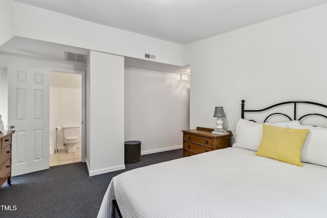 1304 N Duke St, Durham, NC 27701 - bedroom featuring dark carpet and baseboards