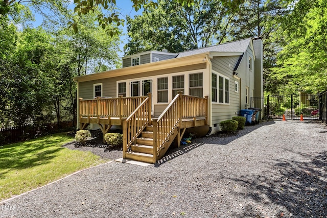 1304 N Duke St, Durham, NC 27701 - rear view of house featuring a wooden deck and crawl space