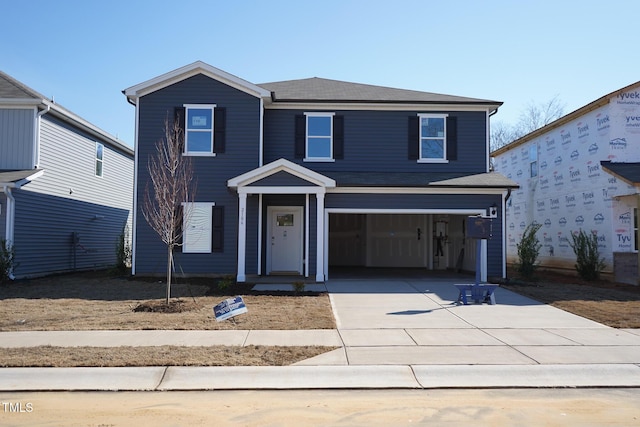 2106 Cherry Creek Rd, Haw River, NC 27258 - traditional home featuring driveway, a garage, and a shingled roof