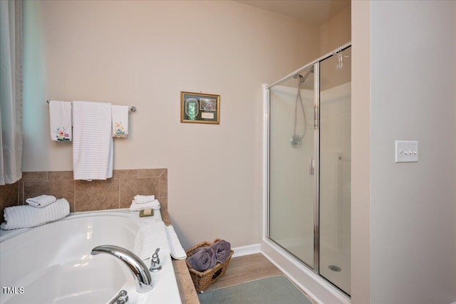 6512 Blalock Forest Dr, Willow Springs, NC 27592 - full bathroom with a stall shower, a bath, and wood finished floors