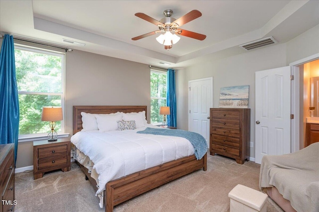 6512 Blalock Forest Dr, Willow Springs, NC 27592 - bedroom featuring light carpet, a tray ceiling, baseboards, and ceiling fan