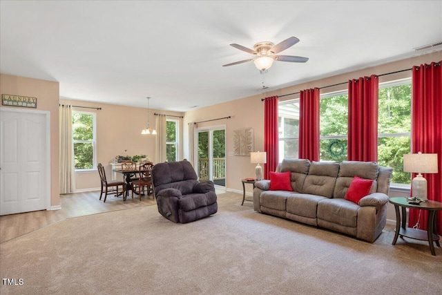 6512 Blalock Forest Dr, Willow Springs, NC 27592 - living area with plenty of natural light, ceiling fan, baseboards, and a chandelier