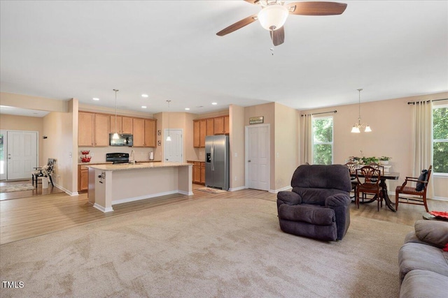 6512 Blalock Forest Dr, Willow Springs, NC 27592 - living area with ceiling fan, baseboards, recessed lighting, a chandelier, and light wood-type flooring